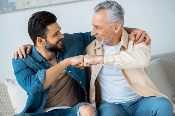 retired-man-fist-bumping